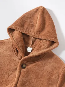 Detail view of brown coral fleece hooded jacket featuring soft texture and button detail
