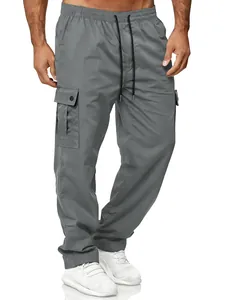 Detailed view of men's grey retro cargo pants featuring elastic waist and side pockets