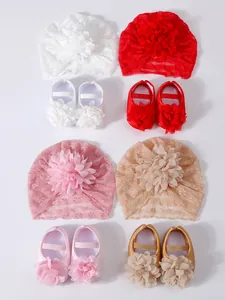 Detailed view of baby lace hats and matching floral princess shoes in four colors