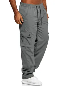 Close-up of men's loose grey cargo pants with adjustable drawstring and side pocket
