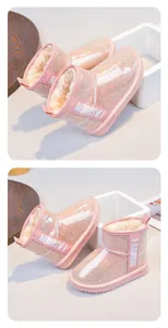 Detailed macro view of pink glitter girls' waterproof snow boots with warm faux fur lining.