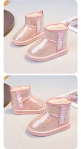 Detailed view of pink glitter girls' snow boots featuring warm faux fur lining and sequins