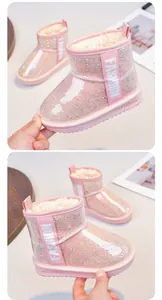 Detail view of pink glitter girl's snow boots featuring waterproof cover and plush lining