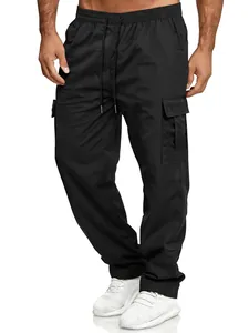Detail view of black cargo pants with elastic drawstring waist and side flap pockets