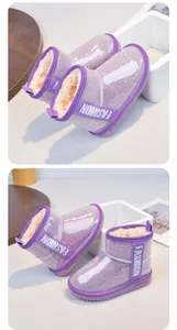 Detail of purple glitter girls' snow boots with warm fur lining and non-slip sole