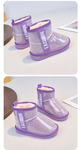Detail view of purple girls' snow boots with glitter and warm plush lining