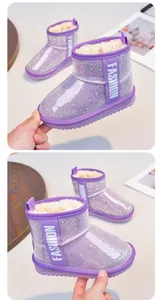 Two views of purple glitter snow boots for girls with warm fur lining and waterproof shell