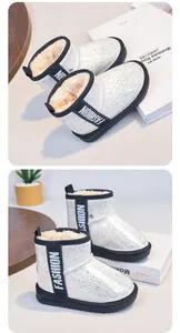 Detailed side view of girls' white glitter snow boots featuring warm faux fur lining