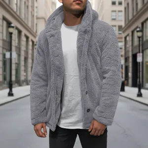 Detailed view of men's gray fuzzy hooded jacket with button closure in street setting
