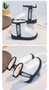 Detailed view of girls' white sparkly snow boots featuring thick warm fur lining and black anti-slip sole