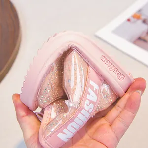 Pink girls winter snow boots featuring flexible non-slip sole and sparkly rhinestone details