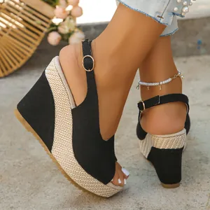 Side view showing the woven platform and black fabric strap of women's wedge sandals