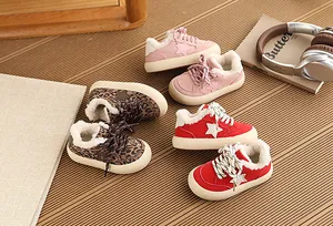 Close-up of children's fleece-lined sports shoes with star pattern details