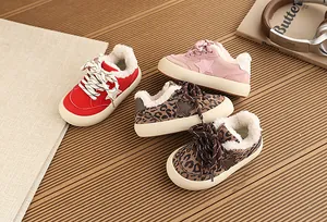 Detailed close-up of warm fleece-lined children sneakers featuring stylish star patterns