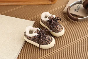 Cozy children's leopard print sneakers with warm fleece lining and thick cream soles.