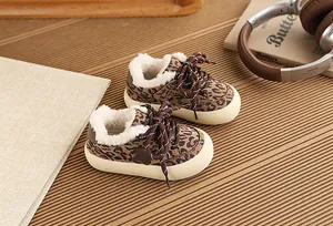 Detail of leopard print children's warm sneakers with soft fleece lining and star patch