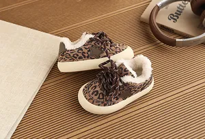 Close-up of toddler leopard print sneakers with warm fleece lining and star detail