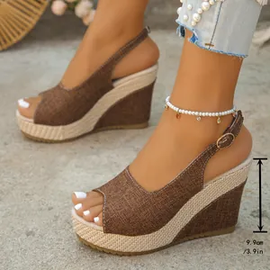 Side detail of brown peep-toe platform wedge sandals showing 9.9cm heel height.