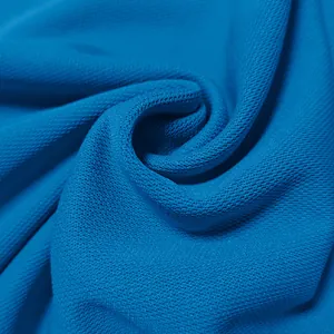 Macro view of the breathable quick-dry blue fabric of a men's business polo shirt
