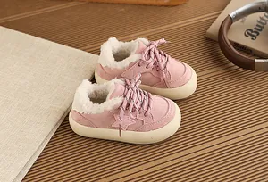 Close-up of pink fleeced-lined children's sneakers with star detail and warm interior
