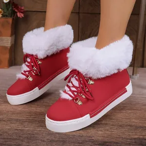Women's red leather snow boots with plush white faux fur trim and lace-up detail