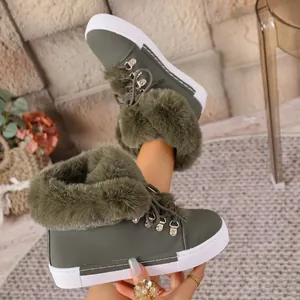 Detail view of olive green snow boots with plush faux fur trim and white rubber soles
