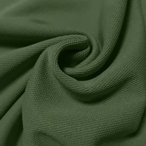 Detailed macro view of breathable olive green piqué knit fabric for men's polo shirt