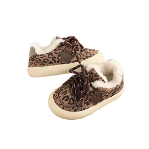 Leopard print children's fleece-lined sneakers with star detail and thick warm soles.