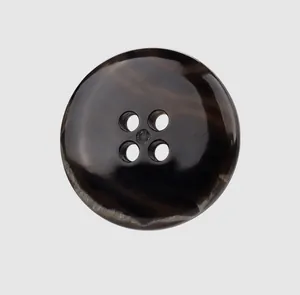 Detailed macro view of a premium dark brown marbled urea button featuring a four-hole design