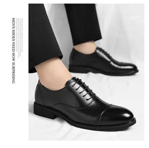 Detailed close-up showing the sleek black leather and cap-toe design of men's dress shoes.