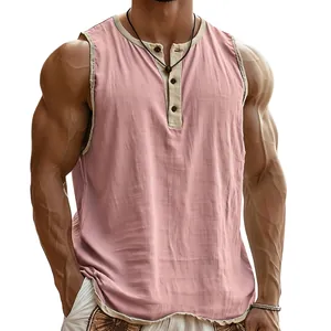 Close-up of pink men's Henley sleeveless tank top with contrast trim and textured fabric