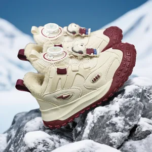 Cozy children's warm winter sneakers with plush lining on snowy mountain background