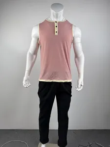 Front view of a men's sleeveless pink Henley tank top with cream contrast trim on mannequin