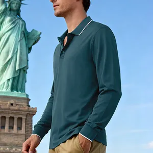 Men's long-sleeve teal polo shirt with white trim detailing in an outdoor city setting
