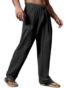 Macro view showing the breathable cotton linen texture of these loose black trousers.