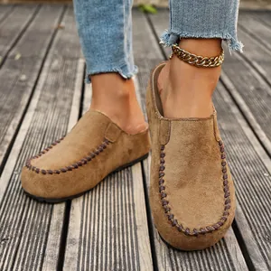 Retro brown suede platform clogs for women with woven stitching and closed toe detail