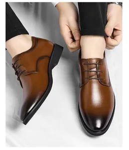 Close-up shot of men's brown gradient leather business dress shoes with lace-up details