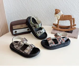 Detailed view of children's camouflage sandals in green, orange, and brown colors
