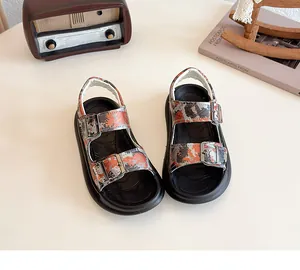 Detail view of camouflage children's beach sandals with double adjustable buckles