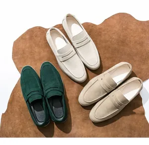 Top view detail of premium men's suede penny loafers in green, beige and cream white colors