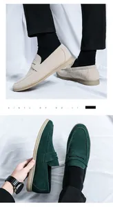 Detailed view of men's suede loafers in beige and green, featuring flexible rubber soles.