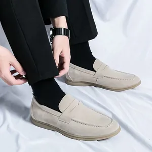 Stylish beige suede loafers for men featuring a comfortable slip-on soft sole design