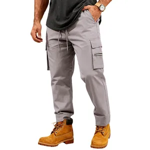 Close-up detail of men's grey tactical cargo pants with pockets and drawstring.