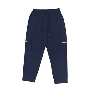 Close-up view of navy blue cargo sweatpants with multi-pocket design and drawstring waist.