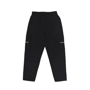 Detailed front view of black baggy cargo pants featuring utility side pockets and stripes
