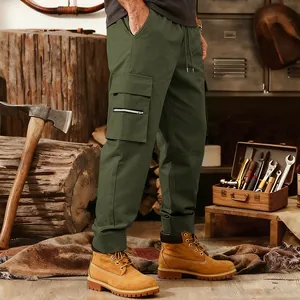 Macro view of olive green tactical cargo jogger pants featuring multi-pocket design