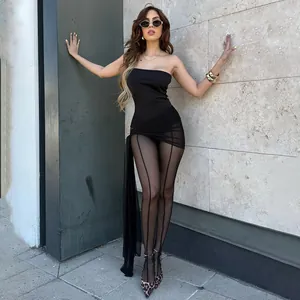 Sexy black mesh patchwork tube top jumpsuit worn by a model against a stone wall background.