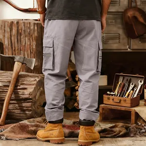 Detailed back view of men's grey tactical cargo pants featuring large functional side pockets