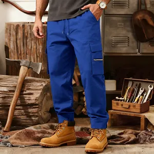 Close-up detail of men's blue tactical cargo pants featuring multi-pocket workwear style