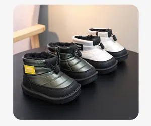 Detailed view of waterproof children's snow boots with warm faux fur lining